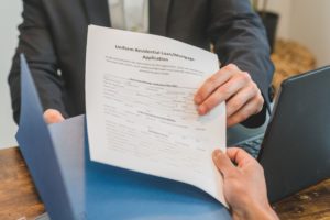 Foreclosure document passing between people
