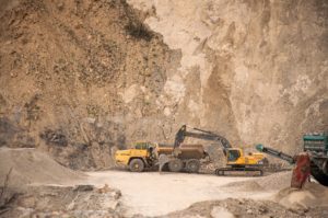Construction vehicle ahead of mineral deposits