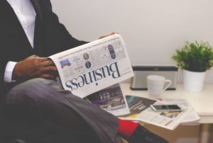 Man looking at newspaper