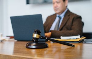 Man sitting at desk with laptop