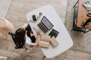 Woman doing work on desk 