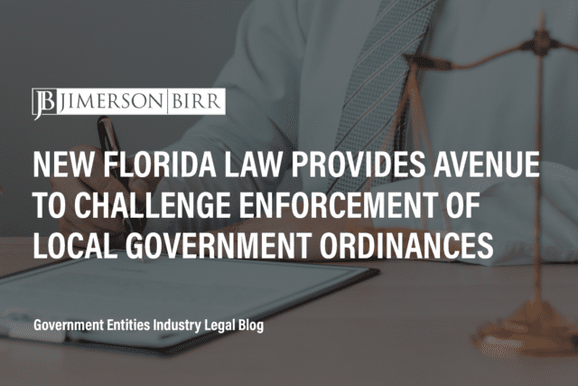 Man in tie signs document with black and gold pen. Text overlay reads: "New Florida Law Provides Avenue to Challenge Enforcement of Local Government Ordinances"