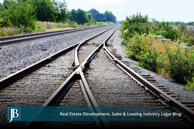 Railroad tracks converging along a rail corridor, illustrating rail takings and eminent domain issues for Florida property owners along the I-4 corridor.