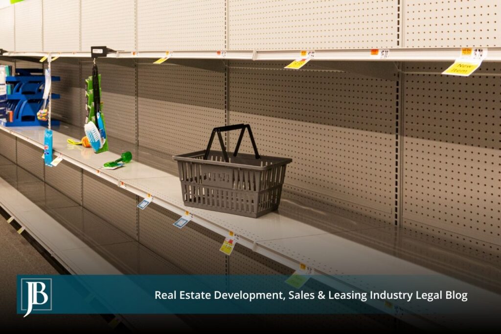 Nearly empty store shelves with a lone shopping basket, illustrating the lost income a Florida business damages claim can recover after a partial taking.