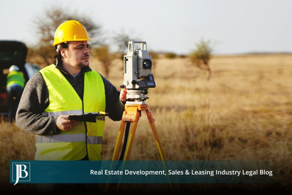 Land surveyor with a total station measuring a Florida field, illustrating the property valuation issues an Eminent Domain Attorney in Florida helps landowners navigate before accepting a condemnation offer.