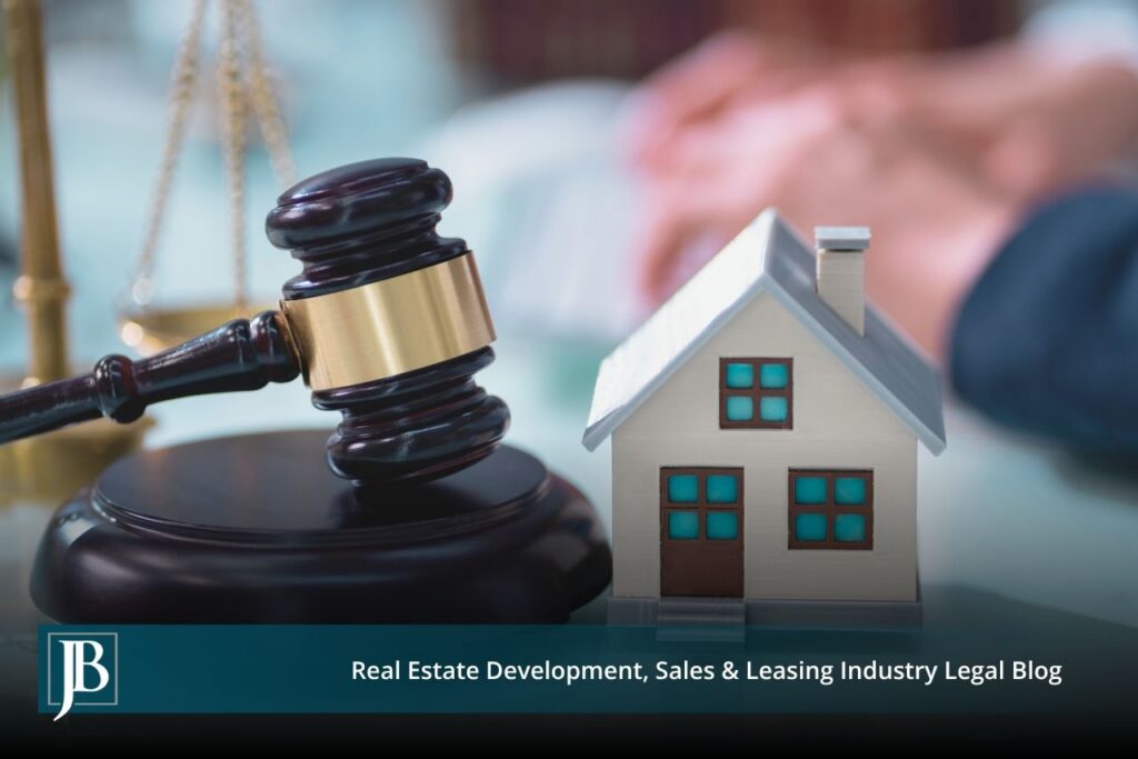 Florida eminent domain lawyer concept image showing a judge's gavel beside a model house, representing property takings and just compensation cases.