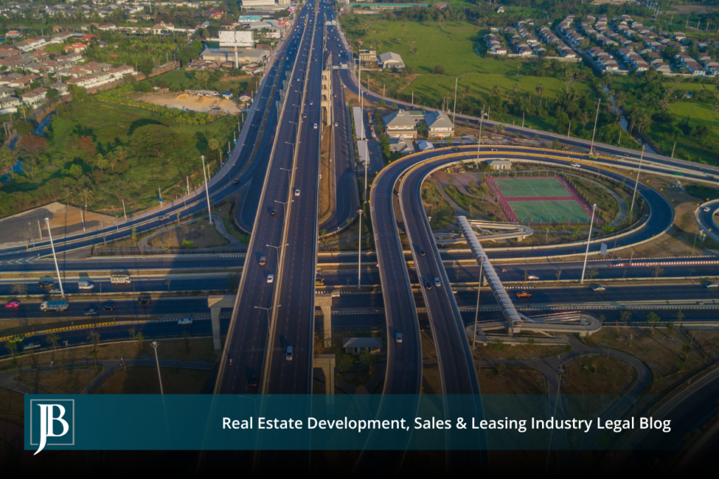 Aerial view of a multi-level Gateway Expressway interchange running through a Pinellas County suburban corridor, illustrating a Florida eminent domain road project.