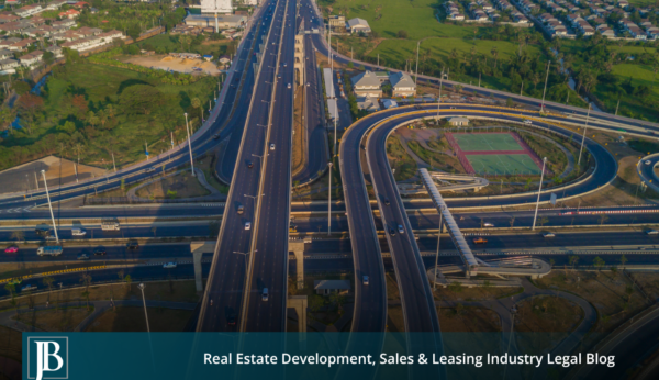 Aerial view of a multi-level Gateway Expressway interchange running through a Pinellas County suburban corridor, illustrating a Florida eminent domain road project.