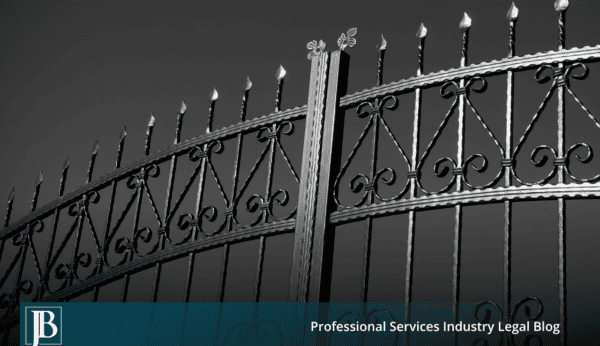 Closed ornate black wrought iron gate photographed against a gray sky, symbolizing the legal gatekeeping standards Florida businesses use to defend fraud claims in commercial disputes.