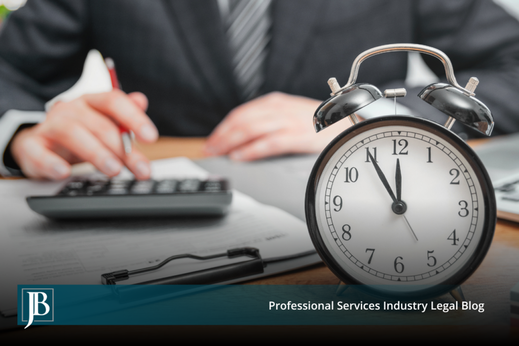 Business professional at a desk with a calculator and paperwork beside an alarm clock, illustrating the timing pressure businesses face when weighing early settlement in consumer class actions.