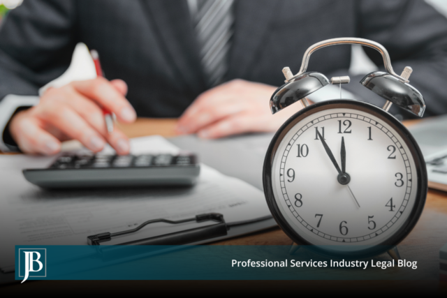 Business professional at a desk with a calculator and paperwork beside an alarm clock, illustrating the timing pressure businesses face when weighing early settlement in consumer class actions.