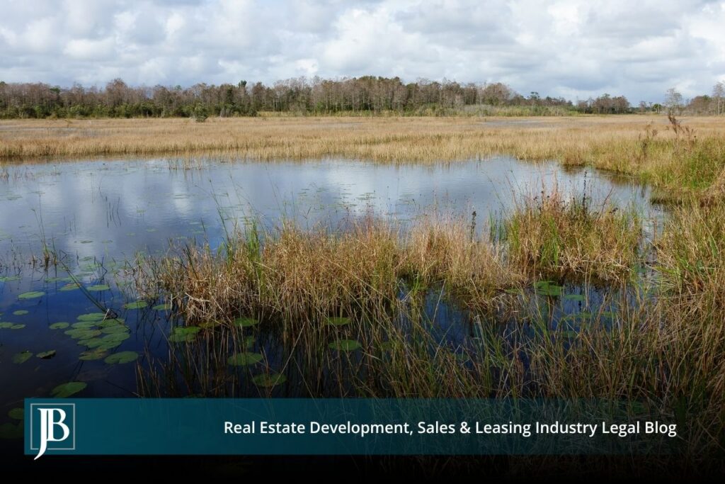 SJRWMD Acquisitions in the Black Creek Watershed: A Landowner's Primer If you own property in or near the Black Creek watershed in Clay County, you may have already heard from the St. Johns River Water Management District (SJRWMD), or you may be bracing for a letter, a phone call, or a knock on the door. The District has spent years building water resource projects in southwest Clay County, and its interest in land across the region is not slowing down. Here is the good news for property owners: a water management district's power over your land is far more limited than most people assume. Understanding those limits is the difference between accepting a first offer and negotiating from a position of strength. This primer walks through what the District can and cannot do, how its acquisition process works, and the rights that protect you at every step. What Is the Black Creek Project, and Why Is SJRWMD Buying Land There? The Black Creek watershed sits in southwest Clay County, and it has become central to northeast Florida's long-term water supply strategy. To understand why the District wants land here, it helps to understand what it is building. The Black Creek Water Resource Development Project at a Glance The Black Creek Water Resource Development Project is designed to capture up to 10 million gallons per day of flow from the Black Creek South Fork when water levels are high enough, then pump that water through a transmission system toward the Keystone Heights area, where it recharges the Upper Floridan aquifer near Alligator Creek. The estimated $41 million project runs through southwest Clay County between Penney Farms and Camp Blanding, and part of its funding comes from the Land Acquisition Trust Fund created by Amendment 1, the Florida Land and Conservation Initiative. A project like this needs a corridor of land and easements to run pipe, build recharge infrastructure, and protect the surrounding water resources. That is where private landowners enter the picture. Why the District Needs Private Land SJRWMD is an 18-county agency headquartered in Palatka, and its core reason for buying land is to protect water resources. According to the District's own land acquisition program, it targets priority lands such as floodplains, sensitive wetlands, and groundwater recharge areas. The Black Creek watershed checks every one of those boxes, which is why owners in the area are seeing acquisition activity. If you are evaluating what a sale or easement means for a larger holding, our team's work on complex real property improvement issues is a useful starting point. Can SJRWMD Take My Land by Eminent Domain? This is the question that keeps landowners up at night, and the answer is more reassuring than you might expect. The Limited Condemnation Power of Water Management Districts Florida law grants water management districts broad authority to acquire land by purchase, gift, lease, or eminent domain. But there is a crucial catch written directly into the statute. Under Florida Statute Section 373.139, the District's "eminent domain powers may be used only for acquiring real property for flood control and water storage or for curing title defects or encumbrances to real property owned by the district or to be acquired by the district from a willing seller." Read that again, because it is the single most important sentence for any landowner in the Black Creek watershed. The District cannot simply condemn your property for general conservation, aquifer recharge, or water supply development. Its forced-taking power is restricted to flood control and water storage, plus narrow title-clearing situations. For most other purposes, the District has to find a willing seller. Whether a specific project component qualifies as "flood control and water storage" is a legal question that turns on the facts, and it is exactly the kind of issue where experienced eminent domain and condemnation counsel earns its keep. Do not assume the District's characterization of its own project is the final word. What "Willing Seller" Really Means The phrase "willing seller" is your leverage. If the District wants your land for a purpose outside its condemnation authority, it needs your agreement to sell. That means you set terms, you can say no, and you can negotiate price, scope, and conditions. It also means the District often invites landowners to come to it. The District accepts applications from owners who want their property considered for purchase, and every restriction, term, and condition of a purchase is negotiable. Being a willing seller does not mean being a passive one. How SJRWMD Acquisition Works, Step by Step Water management district acquisitions follow a structured process. Knowing the sequence helps you spot where you have input and where deadlines matter. The Five-Year Work Plan and Public Notice The District adopts a five-year land acquisition work plan, and it can only do so after a public hearing. It must give at least 14 days' advance notice of that hearing and separately notify the county commission where a proposed project sits. If your property appears in a work plan, that public process is your early warning and your chance to be heard before anything is final. Owners who want to track how a project might affect zoning or development potential should also review land use and zoning considerations. Appraisals and the Confidentiality Window Value drives everything in an acquisition. Under Section 373.139, the District must obtain at least one appraisal for each parcel, and two appraisals are required when the estimated value exceeds $1 million. Those appraisal reports, offers, and counteroffers stay confidential until an option contract is signed or until 30 days before the governing board considers a purchase. That confidentiality window cuts both ways. It can keep you in the dark about the District's number, so getting your own independent appraisal early is one of the smartest moves a landowner can make. A sound valuation record also helps if you ever face a related boundary line or quiet title dispute that affects what you actually own. Fee Simple vs. Less-Than-Fee Acquisition Not every deal means giving up your land entirely. Since 1996, Florida law has encouraged districts to use "less-than-fee" alternatives instead of buying the full ownership package. In practice, that usually means an easement or a set of use restrictions rather than an outright sale. The trade-offs matter: Fee simple means the District buys the complete bundle of ownership rights, and you no longer own the land. Less-than-fee means you keep title, keep the property on the tax rolls, and continue using and managing the land, subject to negotiated conservation restrictions. Because an easement can quietly reshape how you use a property for generations, the specific language deserves close review. Our guidance on easements and restrictive covenants explains why a single clause can matter more than the price. What Are Your Rights and Protections as a Landowner? Whether the District is negotiating a voluntary purchase or pursuing a lawful condemnation, Florida law gives owners strong protections. The Constitutional Right to Full Compensation Florida's Constitution does not just require "just" compensation like the federal standard. Under Article X, Section 6 of the Florida Constitution, no private property can be taken except for a public purpose and with full compensation paid to the owner. Florida courts have long treated this "full compensation" language as one of the most owner-friendly property protections in the country. What Full Compensation Can Include Full compensation is not always limited to the raw value of the dirt being taken. Depending on the facts, it can include damages to the portion of your property that remains after a partial taking, often called severance damages, along with other losses the taking causes. If a pipeline corridor or recharge structure splits a parcel or cuts off access, the impact on what is left can be a significant part of the claim. Owners of income-producing property, including retail, office, industrial, and multi-residential holdings, should pay particular attention to business and rental impacts. Attorney's Fees and Costs Here is another protection unique to Florida eminent domain practice. Under Chapter 73 of the Florida Statutes, the condemning authority is generally required to pay a property owner's reasonable attorney's fees and costs in a condemnation proceeding, with attorney's fees typically tied to the benefit counsel achieves above the initial offer. In plain terms, in a formal taking, you can often pursue full compensation without paying legal fees out of pocket. That structure exists precisely so owners can afford to stand up to a government agency. What Should You Do If SJRWMD Contacts You? If the District reaches out, a calm and organized response protects your position. Consider this a starting checklist: Do not sign anything on the spot. A first offer is an opening position, not a final one. Ask which authority the District is using. A voluntary purchase and a condemnation are not the same, and the difference affects your leverage. Get your own appraisal. The District's valuation is confidential and built for the District, not for you. Map the full impact. Consider access, severance damages, easement scope, and future use, not just the offer price. Preserve every document. Save letters, plans, and notices, and note the date of every contact. Talk to counsel early. The earlier you involve an attorney, the more options you keep open. Common Questions From Black Creek Watershed Landowners Can the District force me to sell for aquifer recharge? Generally no. As explained above, Section 373.139 limits condemnation to flood control and water storage or to curing title. Pure recharge, conservation, or water supply purposes usually require a willing seller, though the legal characterization of a project can be contested. Is an easement better than selling outright? It depends on your goals. A less-than-fee easement lets you keep ownership and use, but the restrictions can be permanent and far-reaching. Compare the long-term limits against the price before deciding, and have the easement terms reviewed. What if the District's project damages the rest of my land? Damage to your remaining property can be compensable in a taking. Document the impact and raise it early, because these severance issues are frequently undervalued in first offers. What if there is a title problem or a competing claim on my property? Title defects can complicate or delay an acquisition and reduce what you are paid. Resolving issues like slander of title, a partition among co-owners, or correcting a flawed instrument before you negotiate can meaningfully protect your compensation. How Jimerson Birr Helps Florida Landowners Water management district acquisitions sit at the intersection of eminent domain, real estate, and public agency practice, and the District has professionals on its side of the table. You deserve the same. Jimerson Birr represents property owners across Florida in valuation disputes, easement negotiations, and condemnation proceedings, and we understand how projects like the Black Creek development actually affect the people who own land in their path. Whether your matter involves a voluntary purchase, a construction impact governed by construction law in real estate litigation, or a formal taking, our Florida eminent domain attorneys can help you evaluate the District's authority, test its valuation, and pursue the full compensation the law guarantees. If SJRWMD has contacted you about property in the Black Creek watershed, the time to understand your rights is before you respond, not after. Contact Jimerson Birr to see how we can help protect your rights.