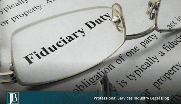 eading glasses and a fountain pen resting on a printed page defining fiduciary duty, illustrating a Florida business breach of fiduciary duty claim.