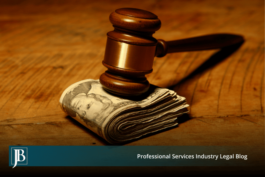 Wooden gavel resting on a folded stack of cash on a wood table, illustrating damages for tortious interference in Florida business litigation.