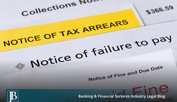 Stack of overdue collection notices, a tax arrears notice, and an unpaid fine notice, illustrating when a business loan is enforced too early or improperly.