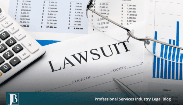 Lawsuit paperwork on a desk with a calculator and financial statements, showing how a lawsuit threatens your business operations.