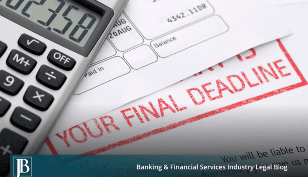 Calculator resting on a past-due commercial account statement showing an overdue balance.