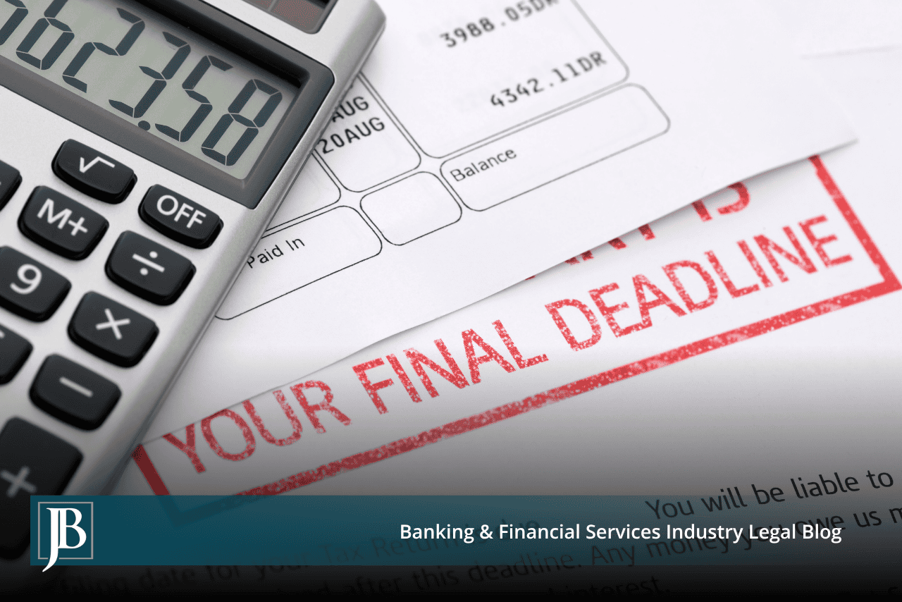 Calculator resting on a past-due commercial account statement showing an overdue balance.