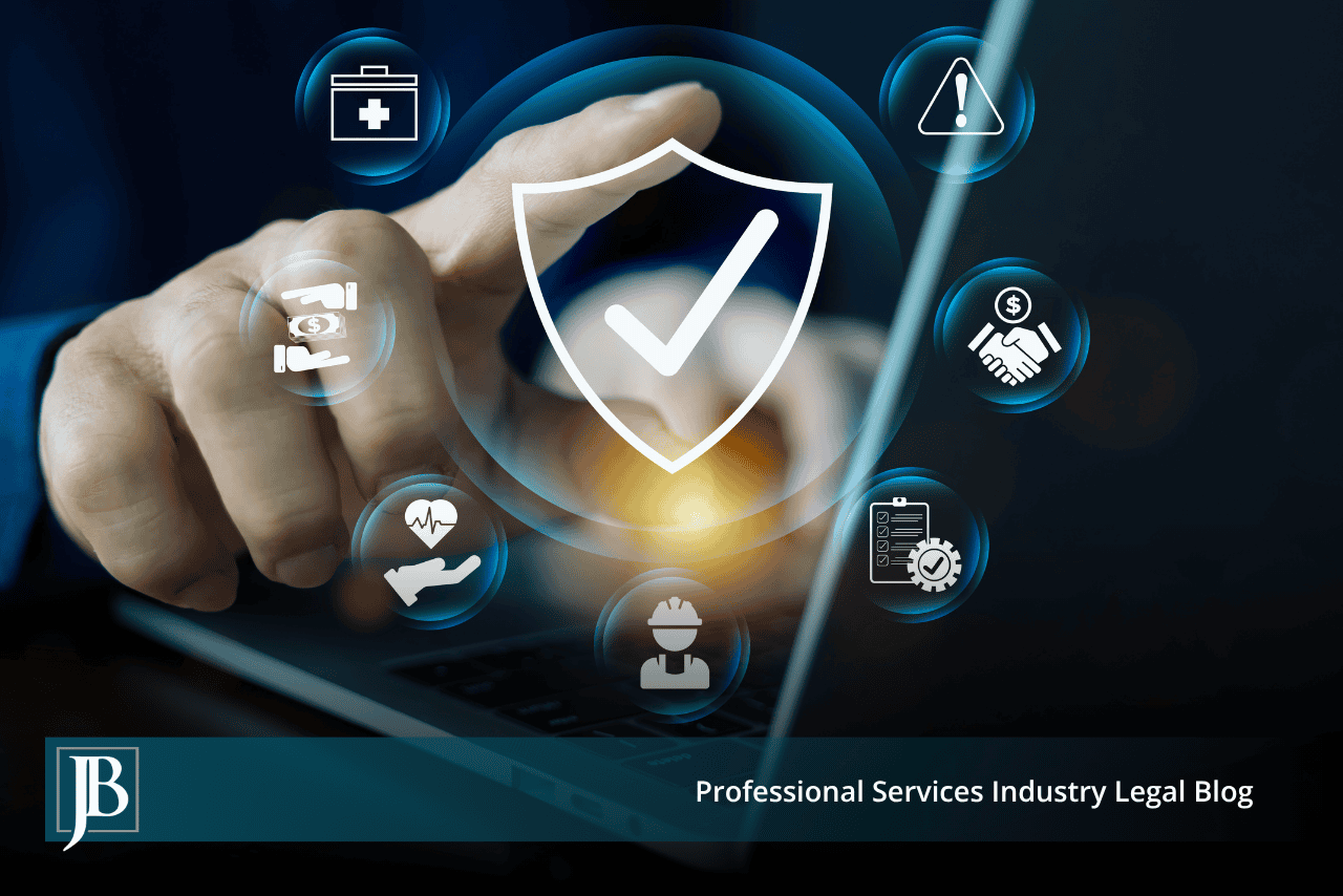 Business professional touching a glowing digital shield icon surrounded by risk management symbols above a laptop keyboard