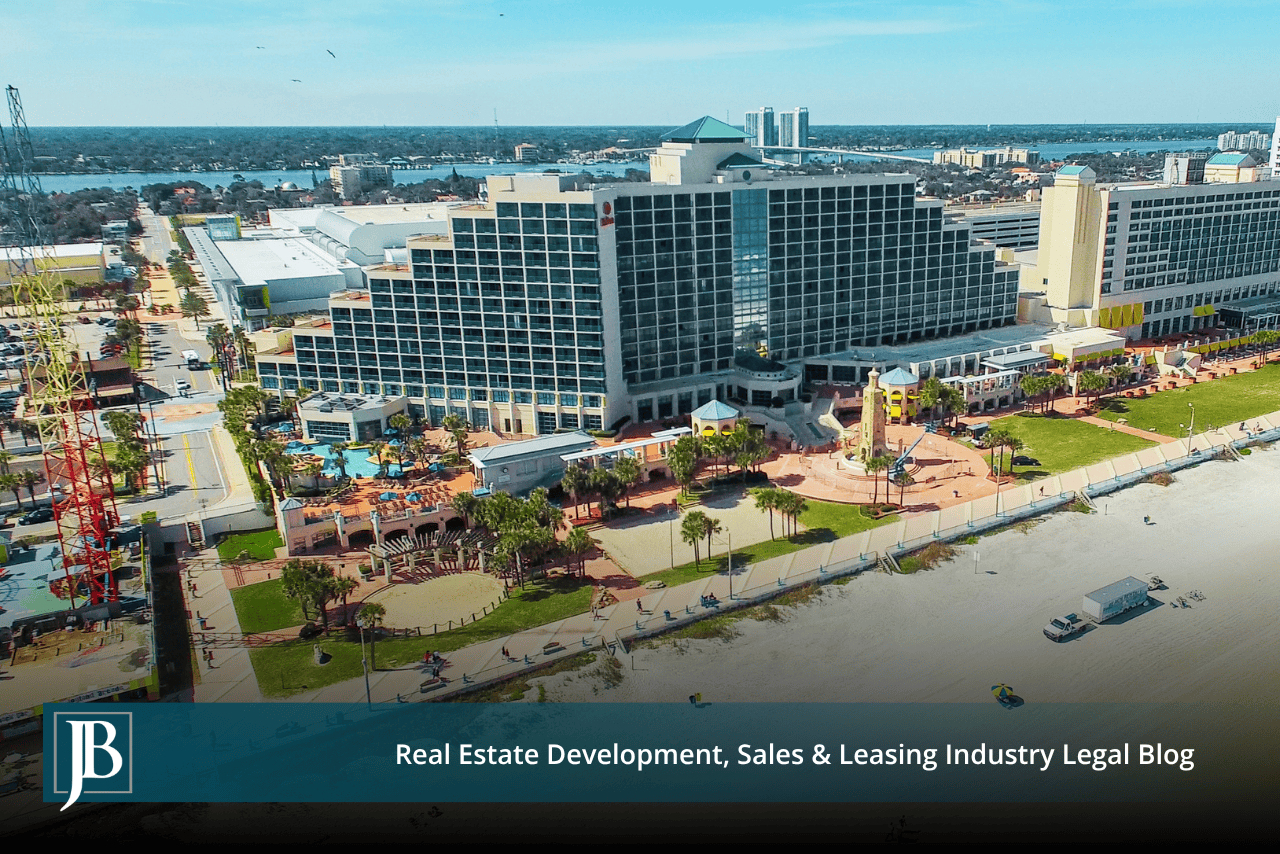 Aerial view of beachfront hotels and a boardwalk, illustrating the kind of commercial frontage at stake in a US 98 taking