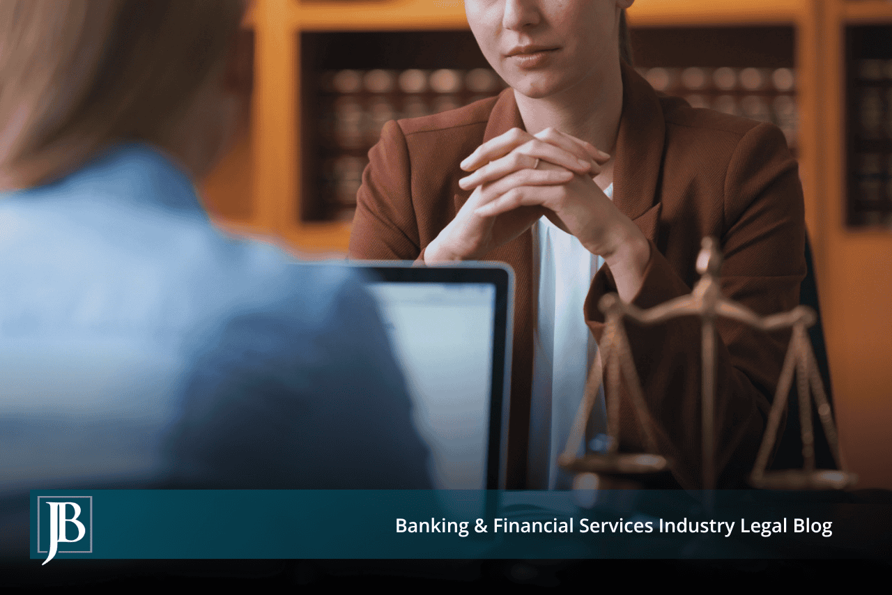 Attorney with clasped hands beside brass scales facing a client, illustrating an out-of-state judgment against a Florida business