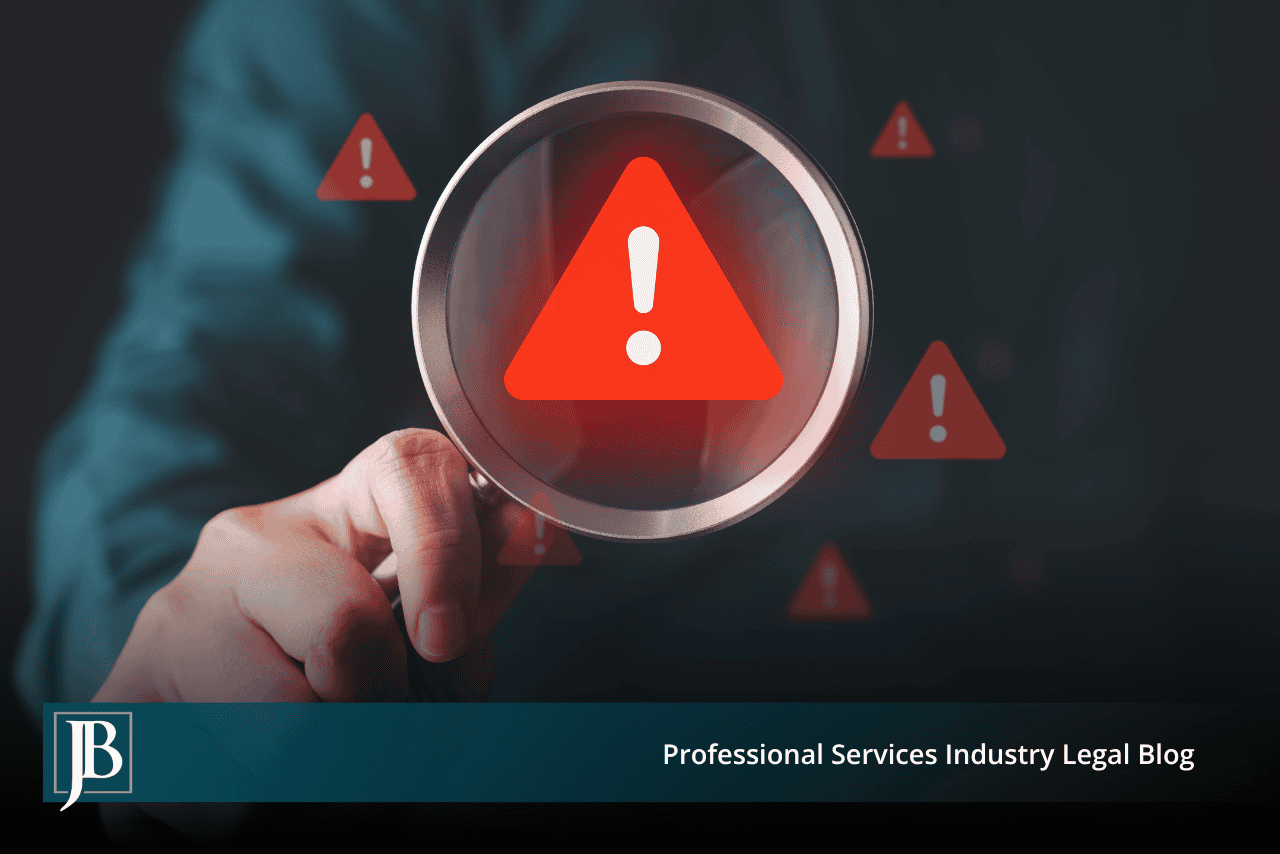 Magnifying glass over a red warning triangle, illustrating how to prove fraud in a Florida business dispute