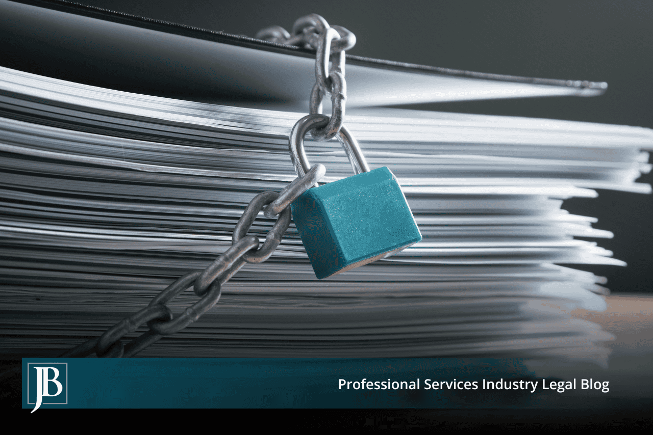 Steel chain and teal padlock locking a stack of papers, illustrating a co-owner who withholds company records in Florida